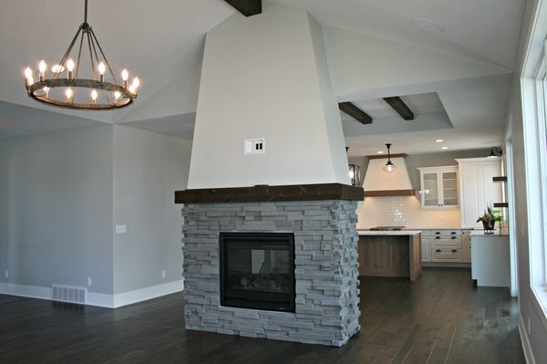 double sided fireplace with stone hardscape.