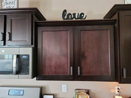 After damaged doors were replaced. Carefree refuses to match the color of the rest of the cabinets.