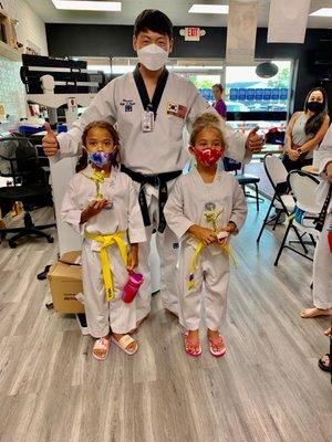 Our girls with Master Kwon after being awarded their trophies for doing their homework at school.