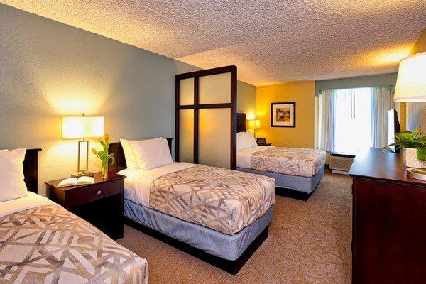 Our Family suite includes one queen bed and two twin size beds. All rooms include AC. Pets are not allowed in the Suites.