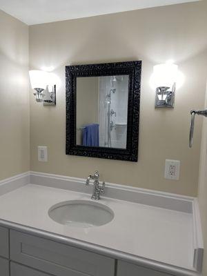 Vanity with backsplash and faucet