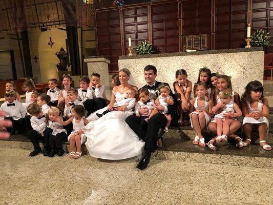 The flower girls and ring boys all wearing guayaberas.