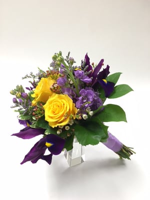 Spring bouquet of purple, lavenders, yellows and whites.