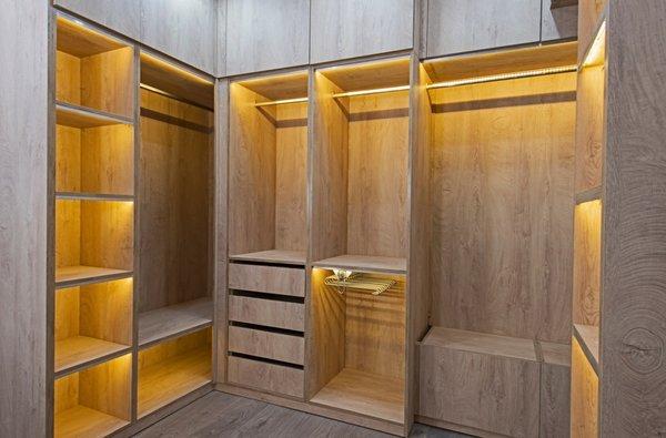 beautiful and functional closet featuring  drawers, shelving and plenty of hanging space.