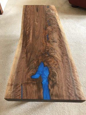 Highly figured black walnut bench with standout turquoise resin