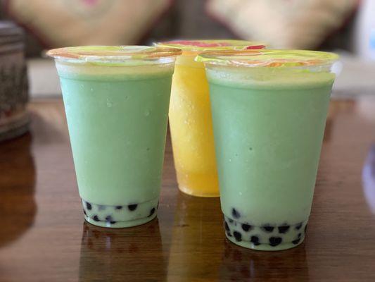 Honeydew and peach smoothies with boba