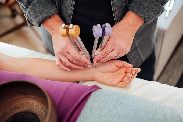 Tuning forks are placed on certain points, similar to acupuncture but without needles.