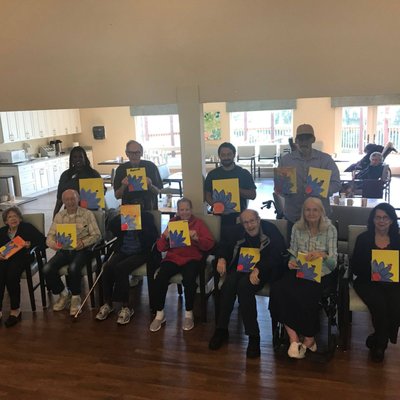 Our memory care residents painting with Dan the Man!