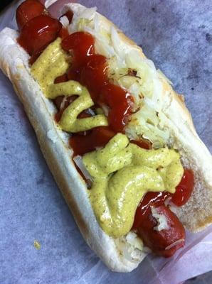 Hotdog with sauerkraut, ketchup, and mustard