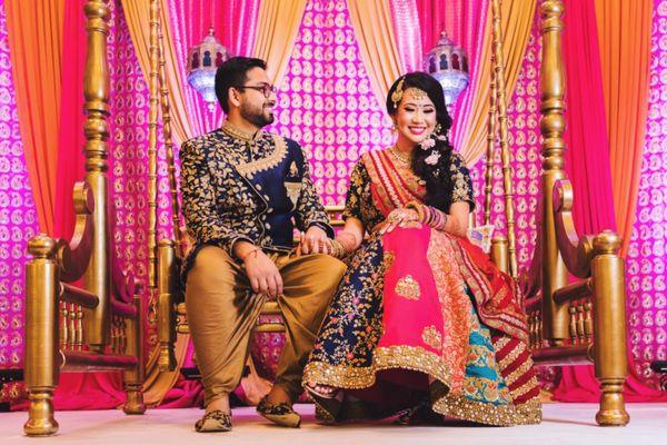 sangeet / garba night backdrop and gold swing