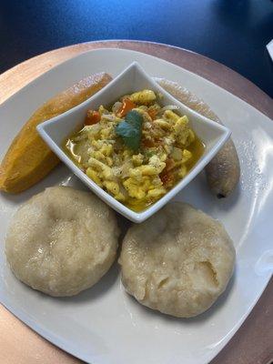 Ackee and saltfish with boiled yam, banana, and dumplings. I think this is a Saturday special.