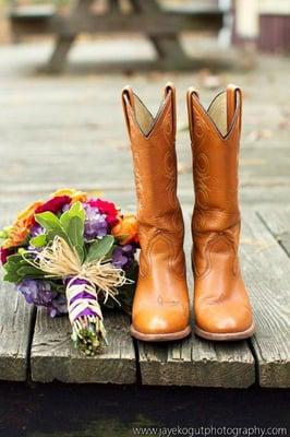 Bride's boots and wedding bouquet ready for her country style affair!