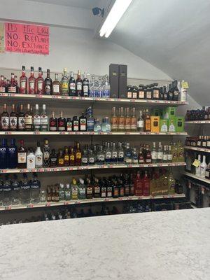 Small selection of spirits behind counter.