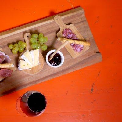 Cheese & Charcuterie platter + a glass of FALLING STAR on our vintage orange table.