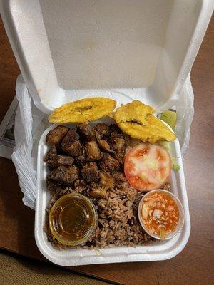 Grios, red beans and rice, fried plantains, the oxtail sauce and some very spicy picklies.