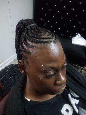 Cornrow ponytail style.