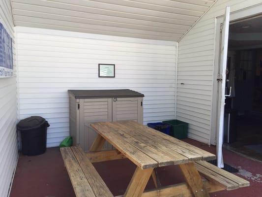 Picnic Bench and Recycling Bin at side entrance to Click IT