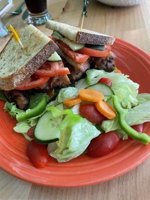 Lemon grass chicken sandwich on sourdough with a side salad instead of fries