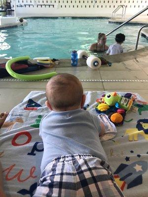 Watching his big brother learn how to swim safely!