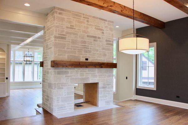 Custom Built Fireplace, Beams, and Coffered Ceiling