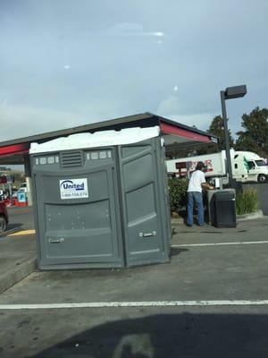 Port a potty 's out front and hand wash