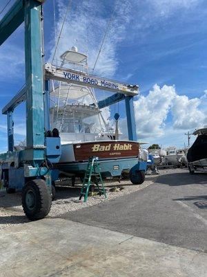 At boat repair checking out other boats and dropping off supplies.