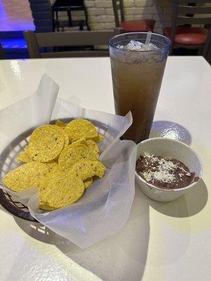 Tamarind water with chips and bean dip -delicious!