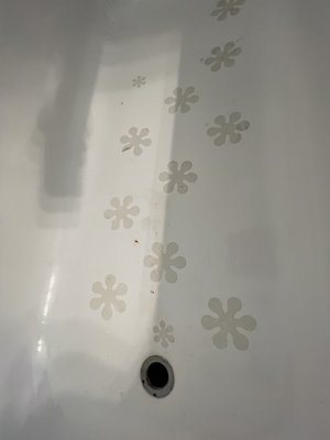 Again tub has these flower stickers in it and does not appear to be clean.