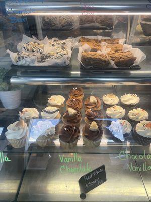 Assortment of cupcakes, blueberry bar, s'mores bar, pumpkin desserts.