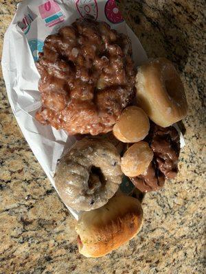 Apple fritters, chocolate old fashioned, blueberry cake, glazed with some doughnut holes.