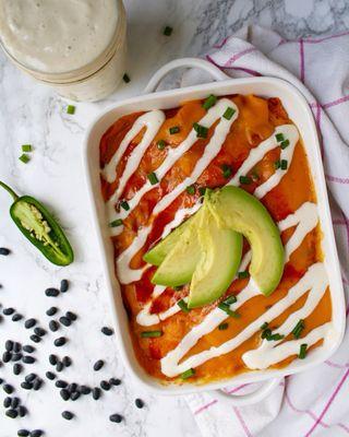 Enchilada Casserole topped with cashew sour cream