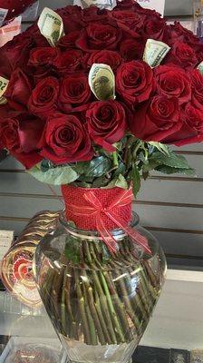 Red roses with money vase. This arrangement has 55+ roses.