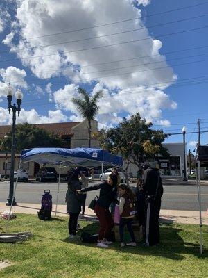 2/26/23 Hubby buying the last few boxes of Girl Scout Cookies at the LOMITA Farmers Mkt