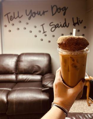 Iced specialty coffee and a pumpkin donut