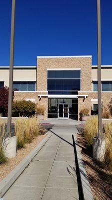 Entrance from parking lot.  Office is first floor, right side.