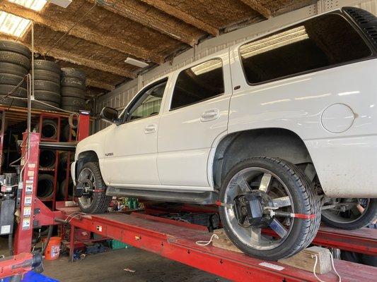 GMC Yukon in for a brand new set of Falkens and an alignment