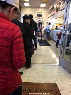 The post office at Christmas is STRESS. Wrong time to go to the Post office....... Long line, 2 worker  :/