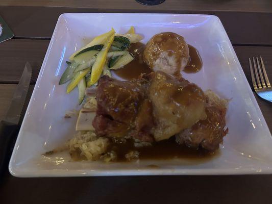 Pork Knuckle with mashed potatoes and veggies