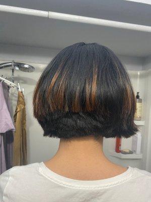 The back was brutalized. The hair stylist was attempting to do a basic "front longer than back" look but it's unfortunately done.