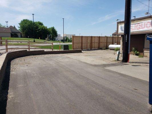 Where 1 wooden fence ends another begins, but you can still see our road.