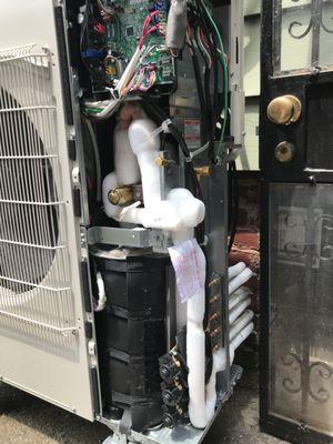 Repair outdoor Mitsubishi heat pump system 36000btu