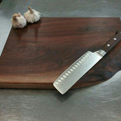 How can you cut meat without a cutting board? 
This one is made by Double A woodworking co. It is black walnut and has a unique live edge!