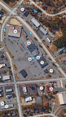 Aerial view of Ponderosa Shopping Center. Blue dot indicates location of shop.