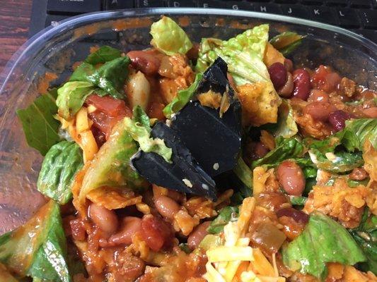 Taco salad with optional shard of plastic