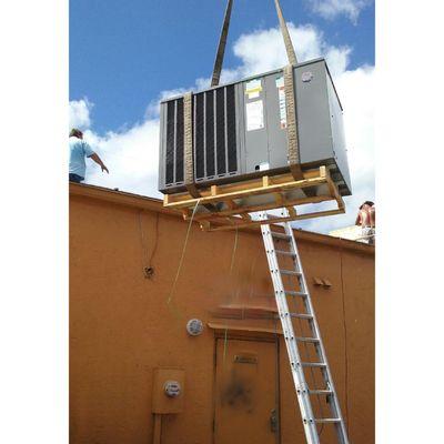 Installing a rooftop package unit.