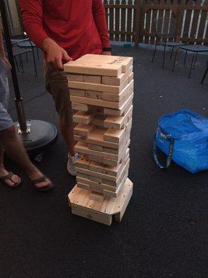 Jenga in action on the patio! Find it in the deck box.