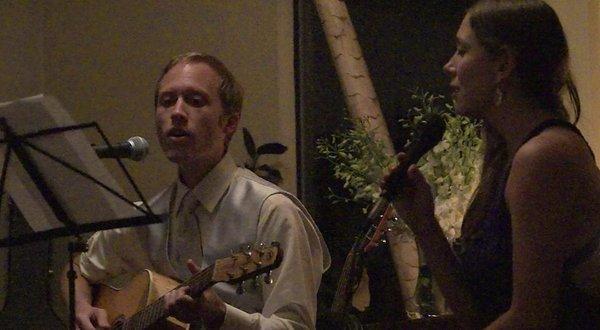 Sam and his wife Olga playing an original song for their dear friends' wedding.