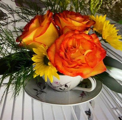 Orange roses with yellow daisies