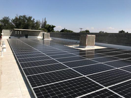 closer view of the 48.9 kw system here in fresno,ca. we put a cover over the inverters to keep them working at max efficiency