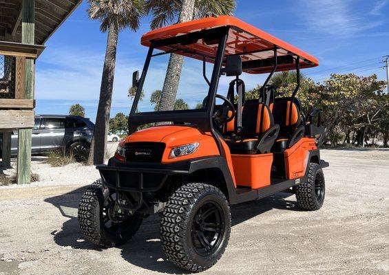 This is our orange 6-seater golf cart at Nokomis Beach.